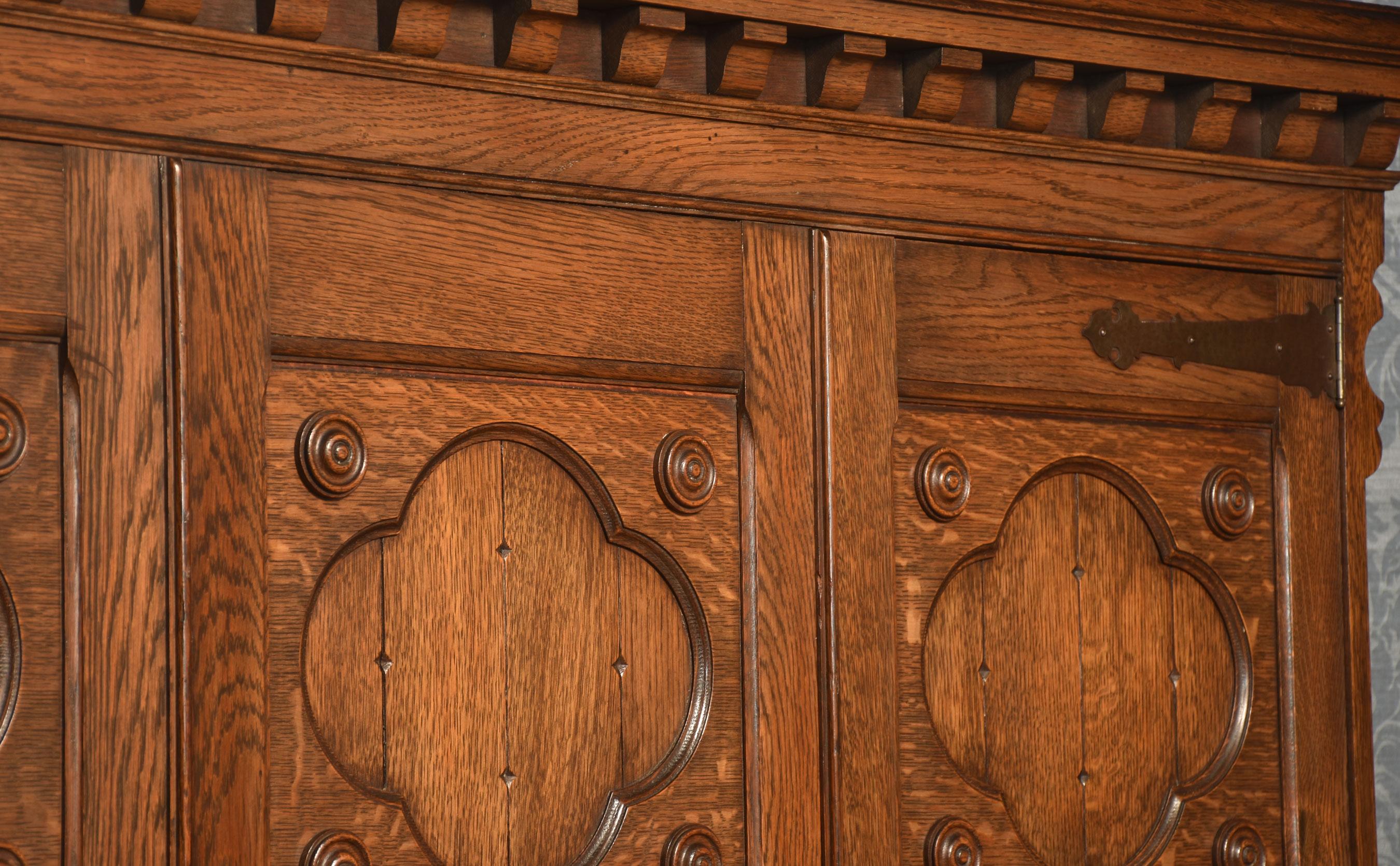 Jacobean style carved oak three door wardrobe For Sale 4