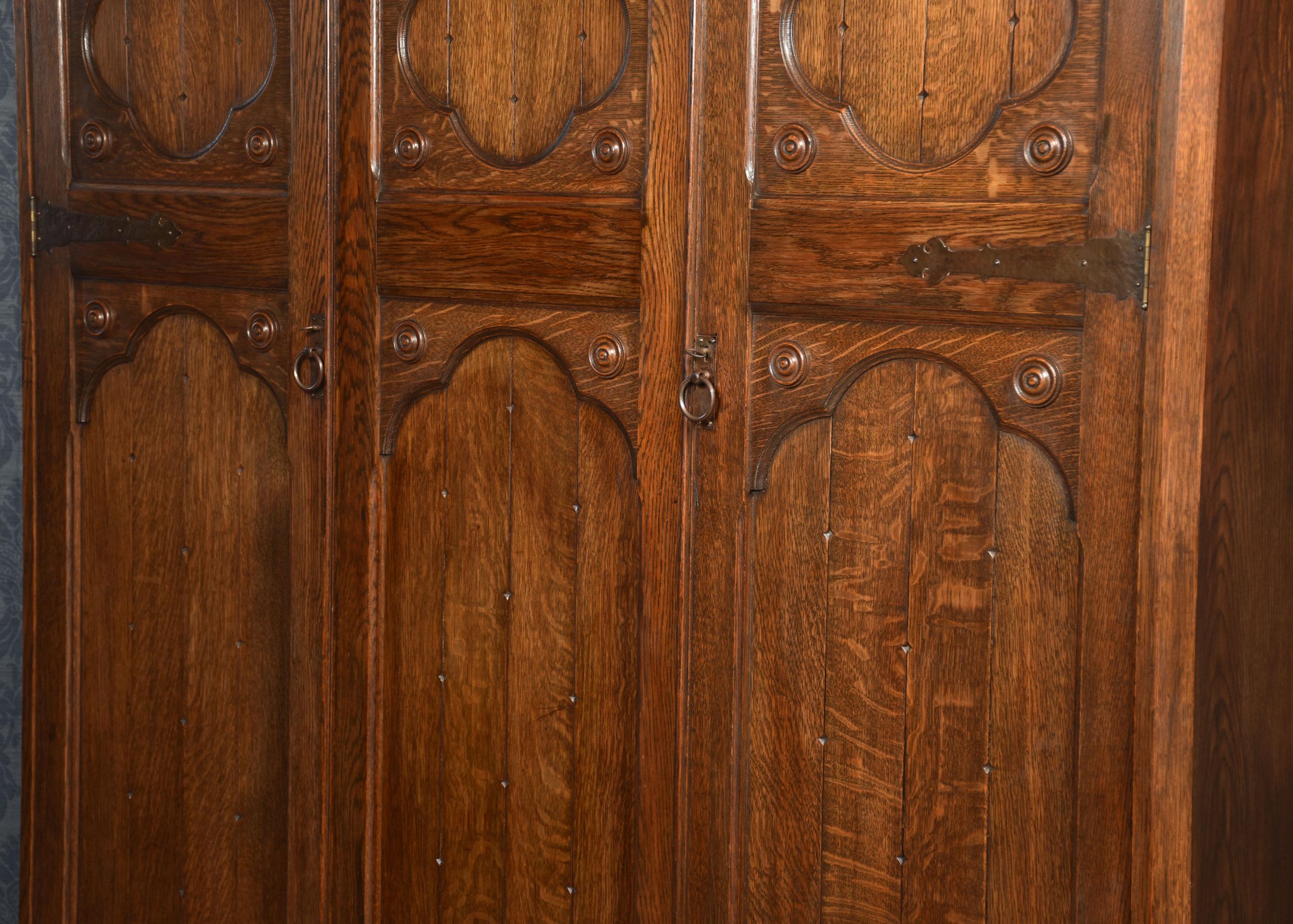 Jacobean style carved oak three door wardrobe For Sale 5