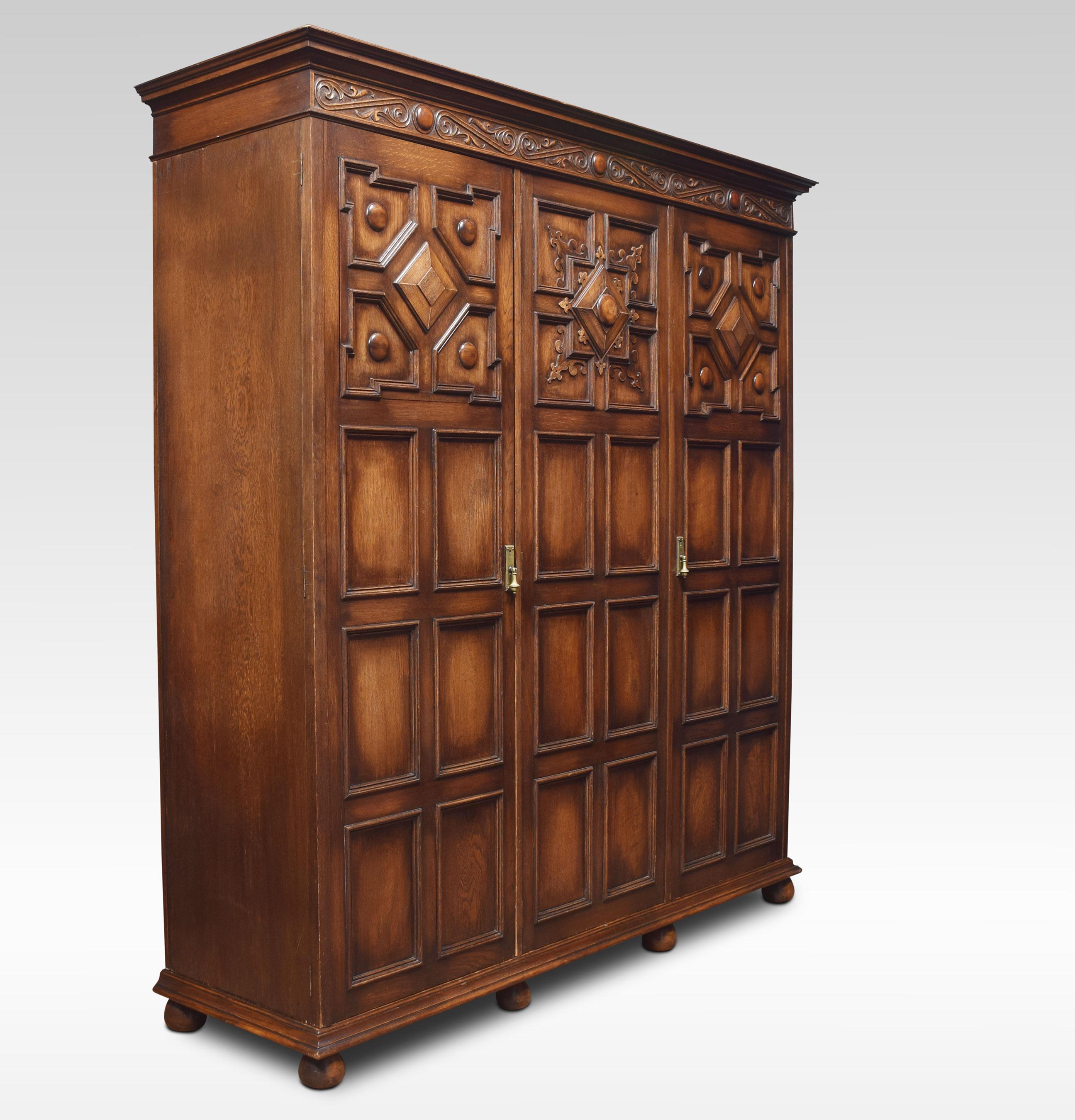 20th Century Jacobean Style Carved Oak Three-Door Wardrobe