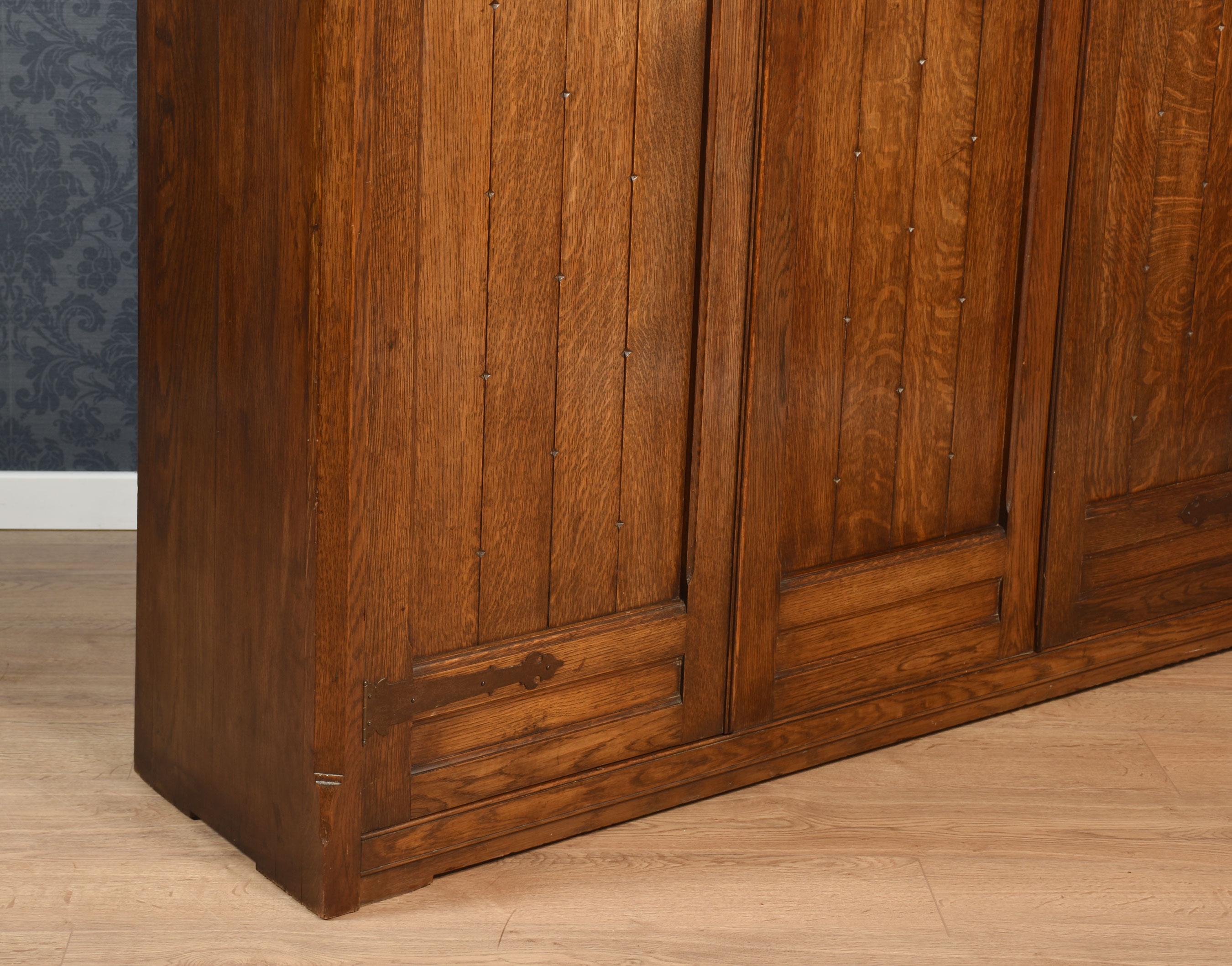 Jacobean style carved oak three door wardrobe For Sale 1