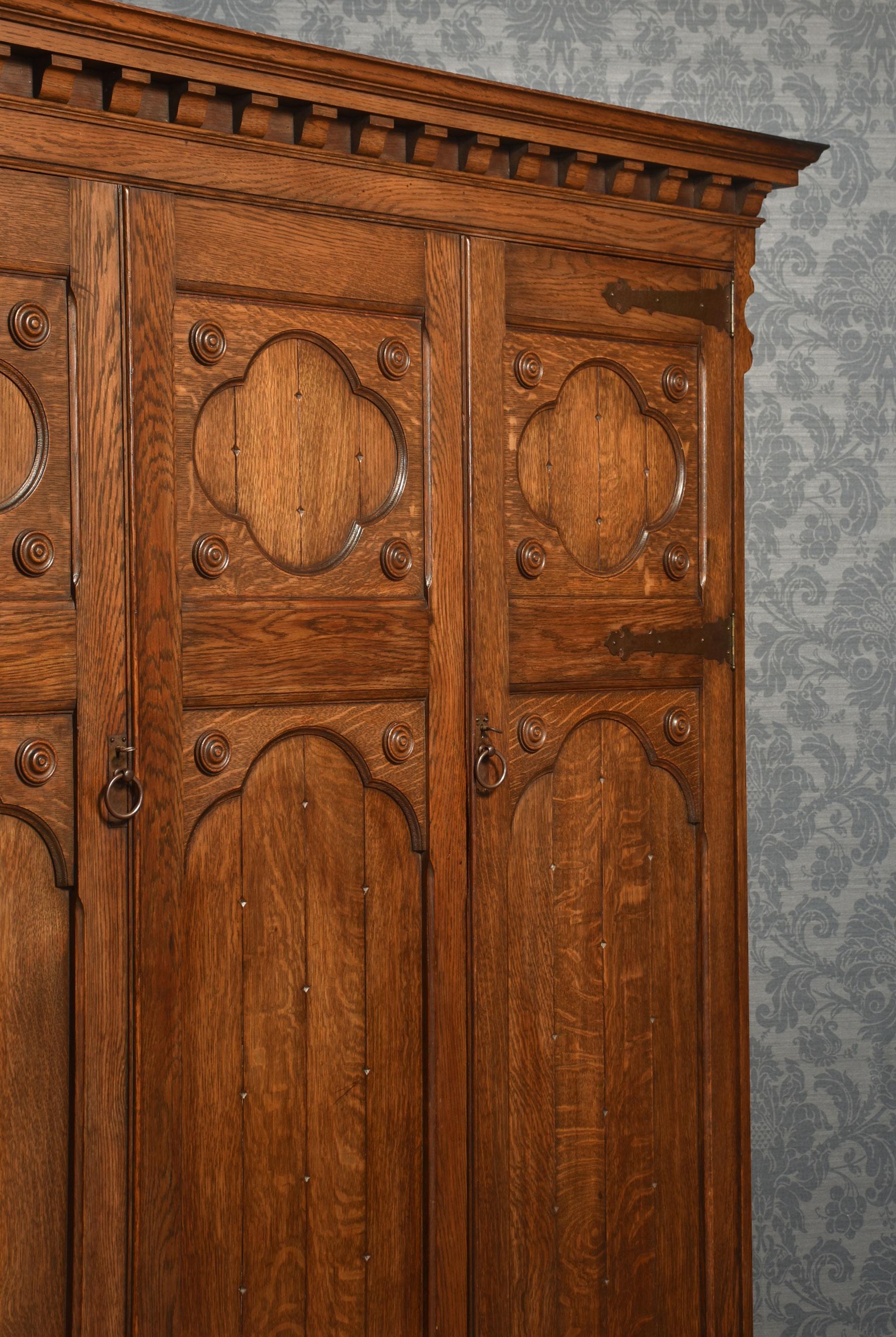 Jacobean style carved oak three door wardrobe For Sale 2
