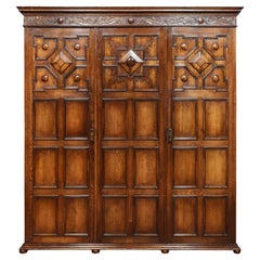 Antique Jacobean Style Carved Oak Three-Door Wardrobe