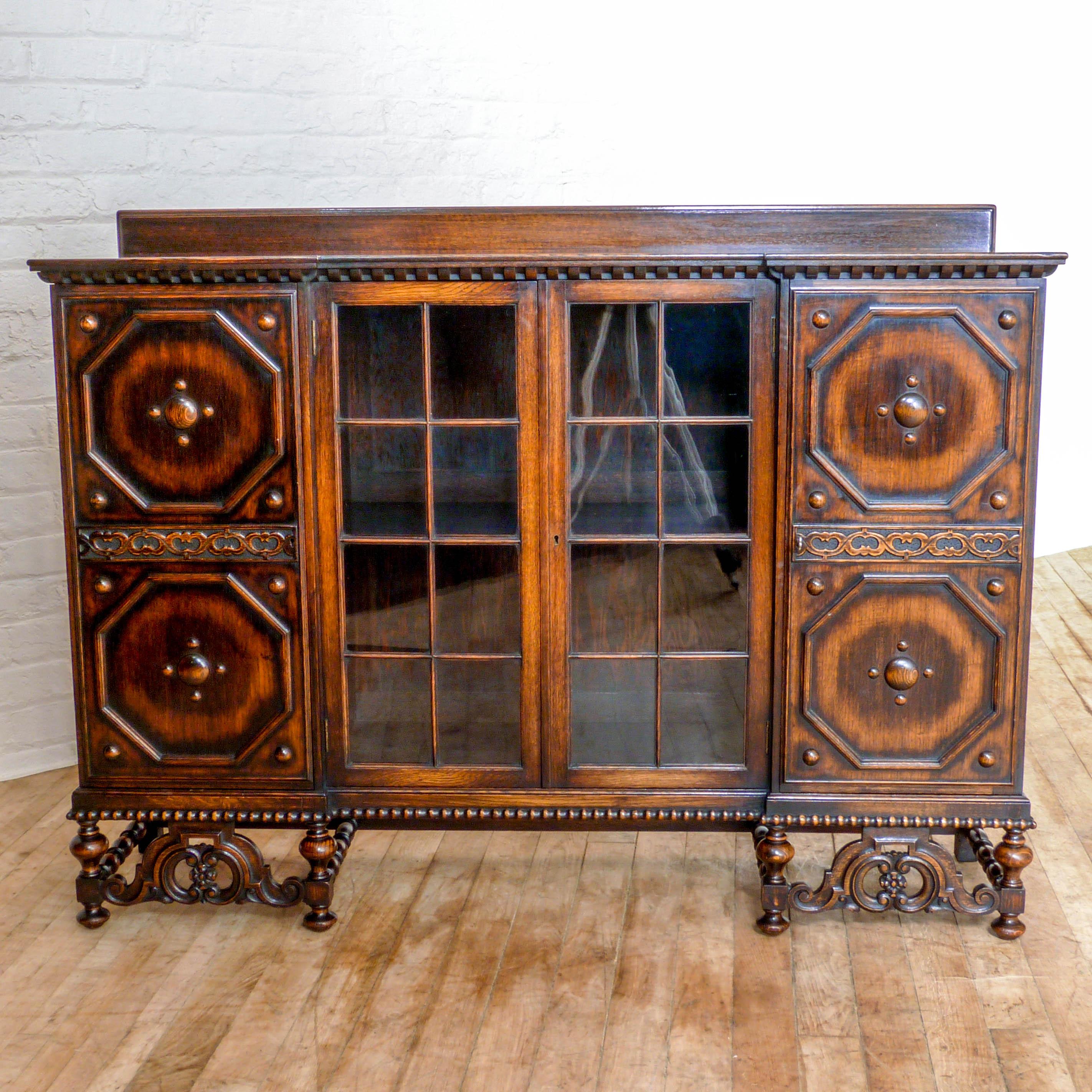 Early 20th Century Jacobean Style Oak Bookcase For Sale