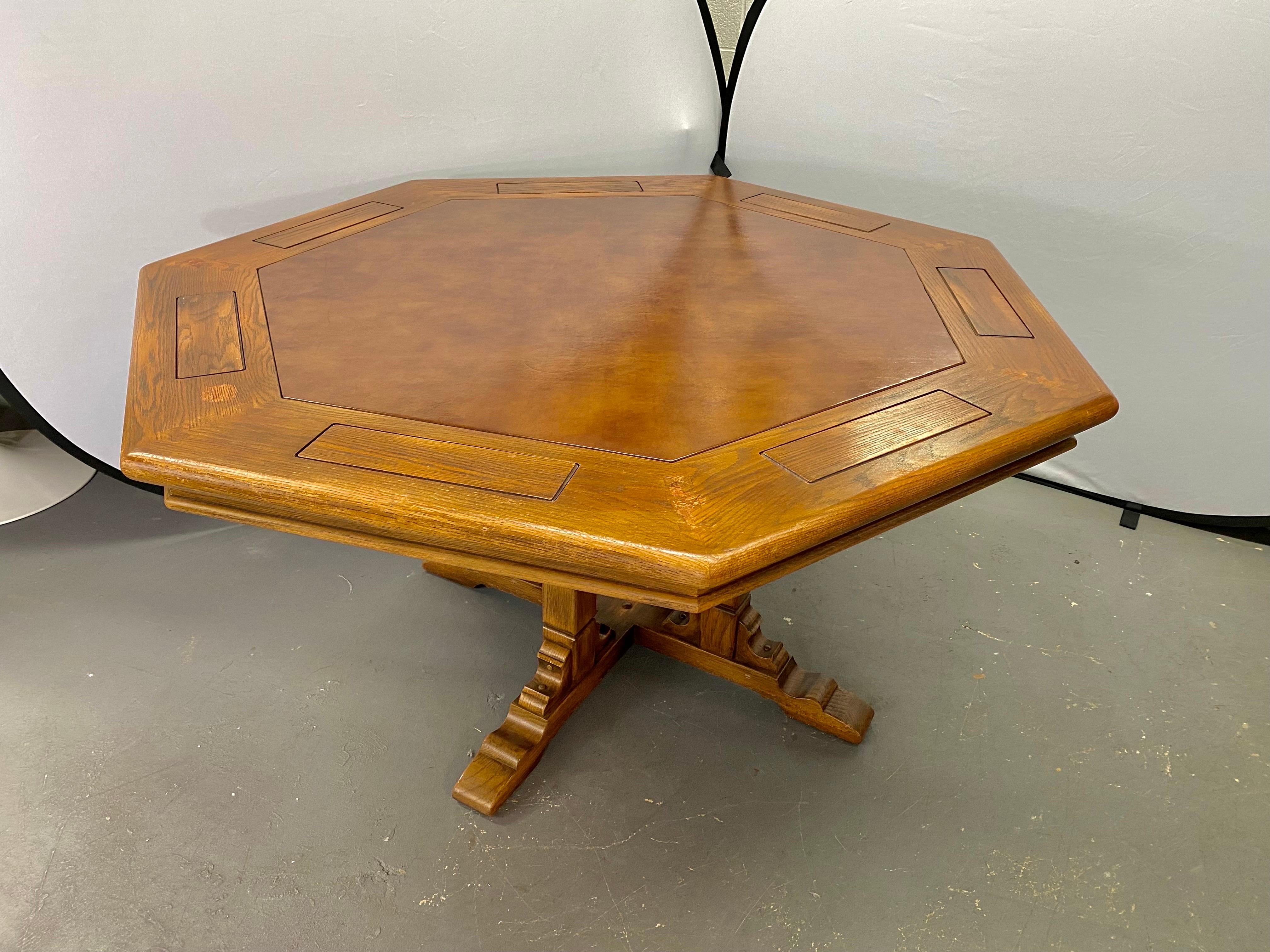 An impressive and rare Romweber viking oak poker game table. The table features 7 sides and a faux leather / vinyl tooled top in light brown matching nicely the color of the wood. The table has 7 solid oak chip holders or caddies which can be