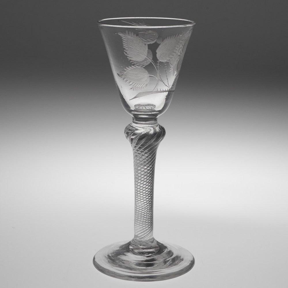 Jacobite Engraved Composite Stem Wine Glass Engraver, circa 1750

Additional Information: 
Period: George II - c1750
Origin: England
Colour: Clear with grey hue
Bowl: Round funnell with engraved flowering rose with one closed bud
Stem: Short