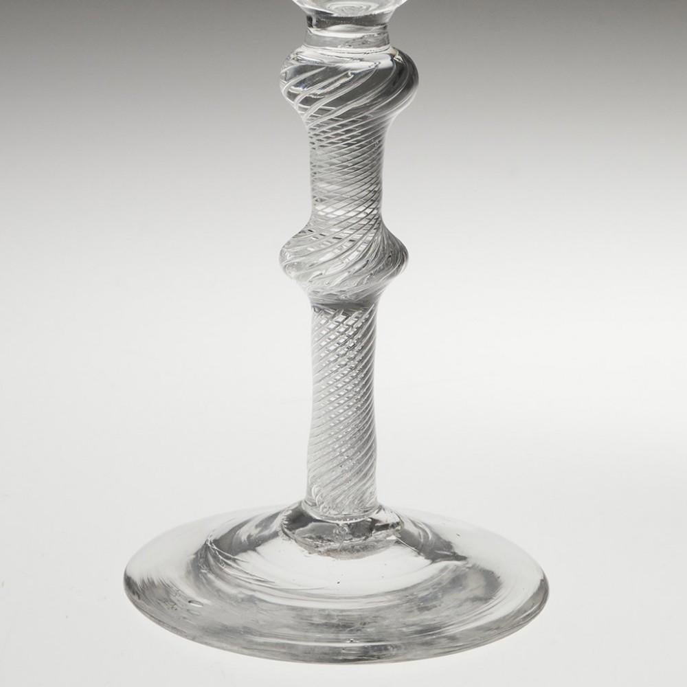 Heading : Double knop air twist stem Jacobite wine glass
Period : George II - c1750
Origin : England
Colour : Clear
Bowl : Round funnel engraved with a rose with a single closed bud and an oak leaf
Stem : Multi spiral air twist with a flattneed knop