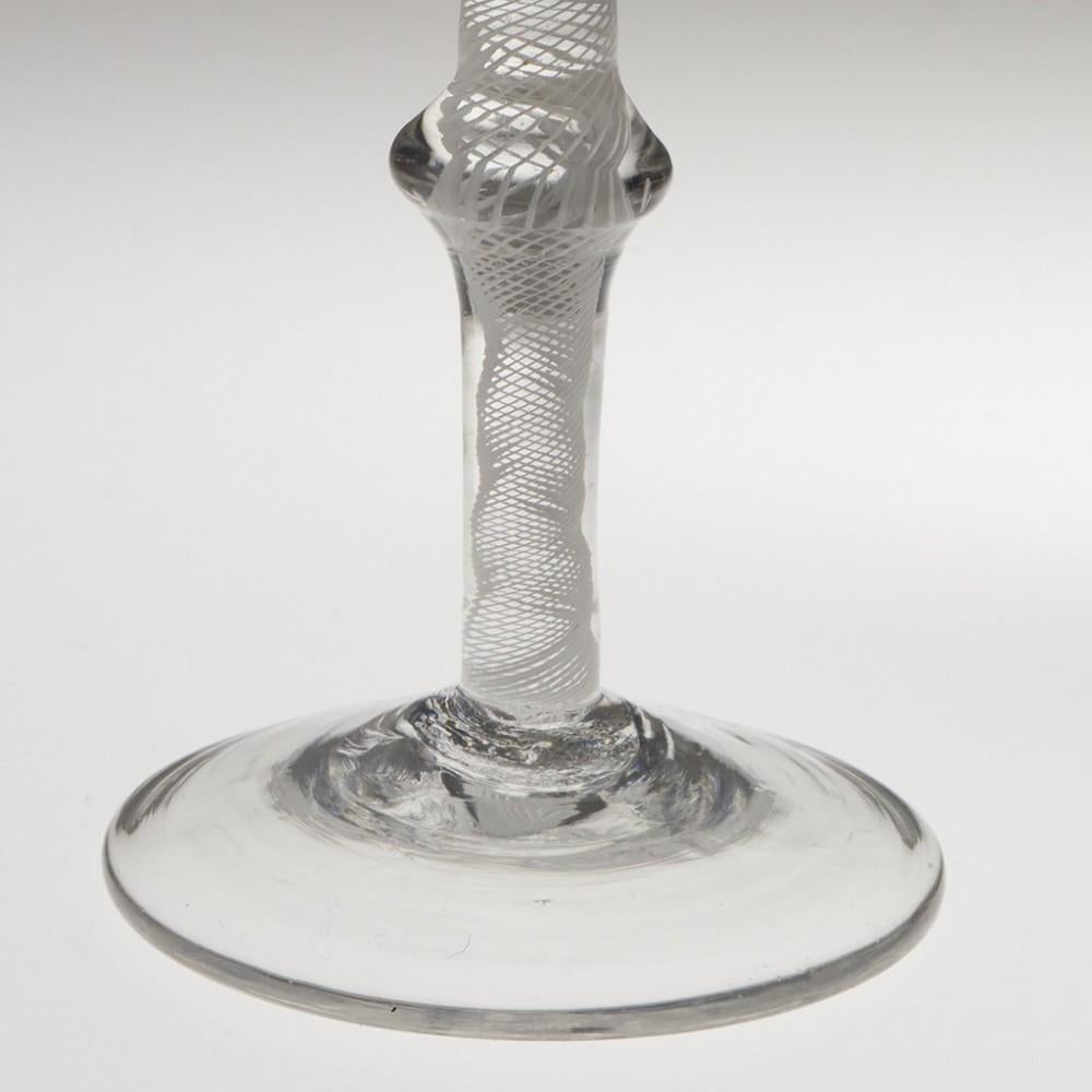 Heading : Jacobite sympathy opaque twist wine glass
Period : George II / George III - c1760
Origin : England
Colour : Clear
Bowl : Ogee - engraved with a closed rosebud and a moth - this has been engraved at a later date with diamond wheel
Stem :
