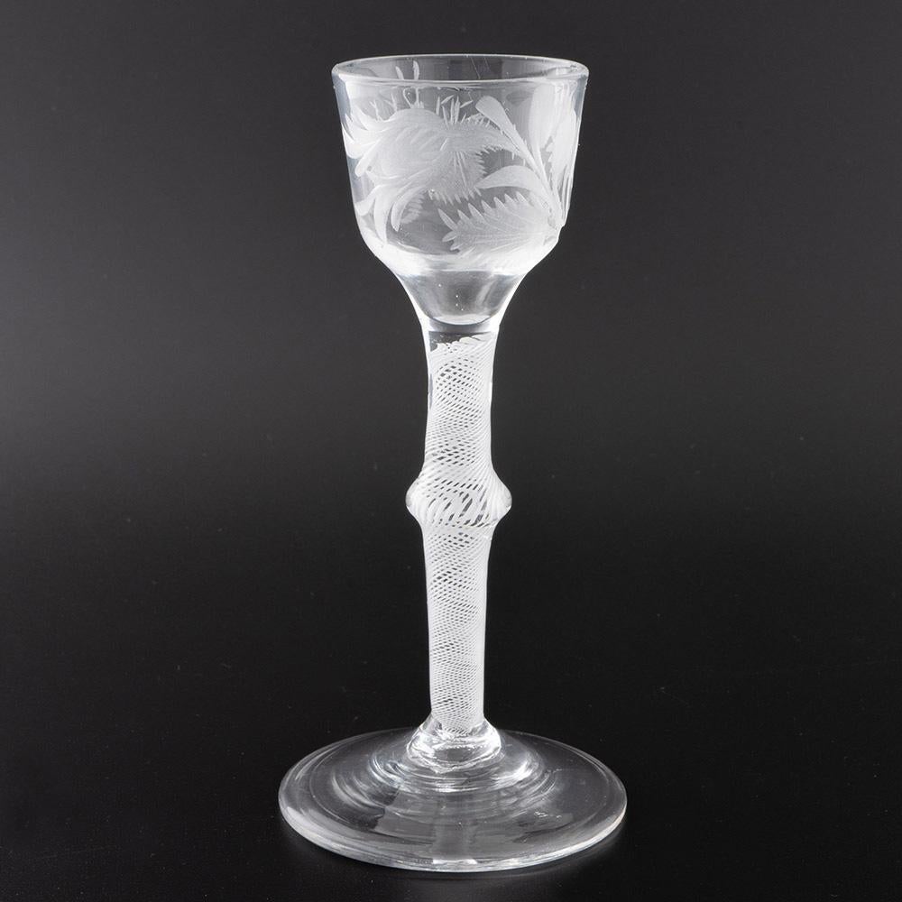 Heading : Jacobite sympathy Georgian wine glass with opaque twist stem
Period : George II / George III – c1760
Origin : England
Colour : Clear
Bowl : Ogee with engraved closed rosebud and moth. The engraving is not contemporary with the glass. It