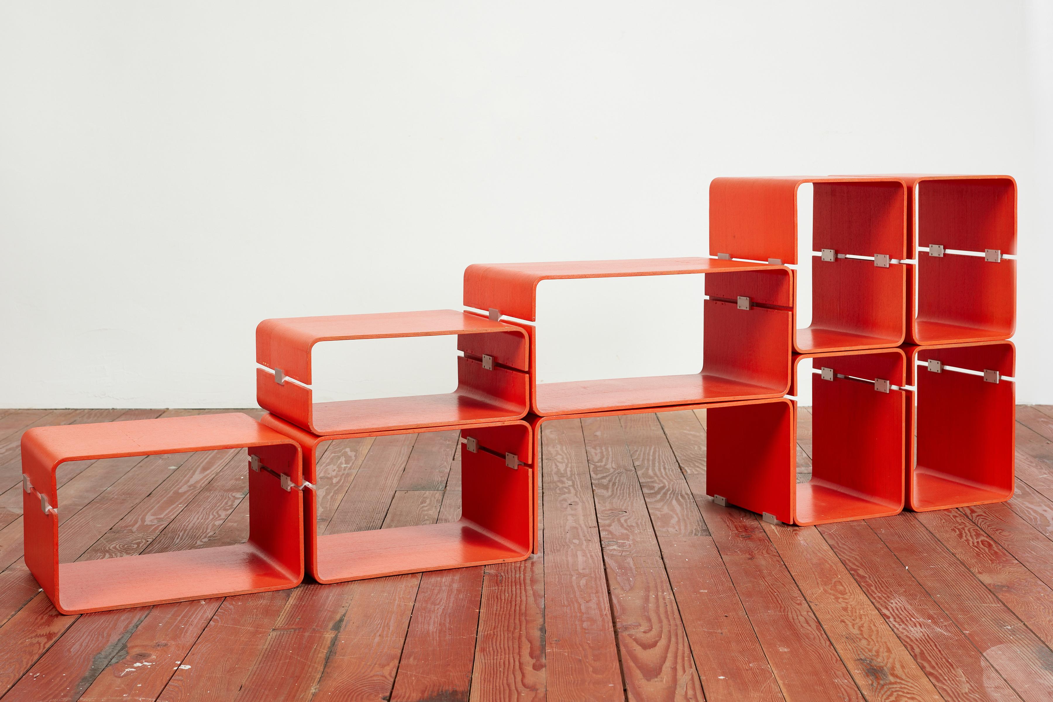 Jacques Dumond bookcase - Lyon, France circa 1963

Fully modular bookcase composed of nine boxes, each in two molded plywood elements connected by cast aluminum hardware that fasten them together.

Bookcase can be constructed in various different