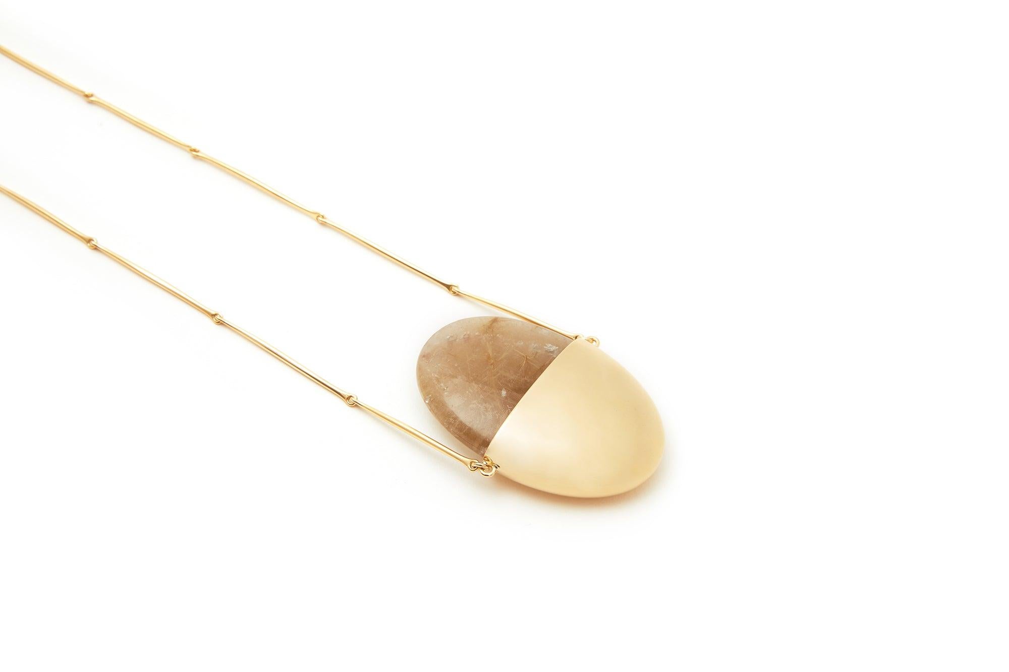 Jacqueline Rabun 
'A Beautiful Life' Small Pendant  
18k Yellow Gold and Rutilated Quartz Crystal

The meditation pendant embraces a sculptural hand carved gemstone which can be removed and held for comfort during moments of stillness and