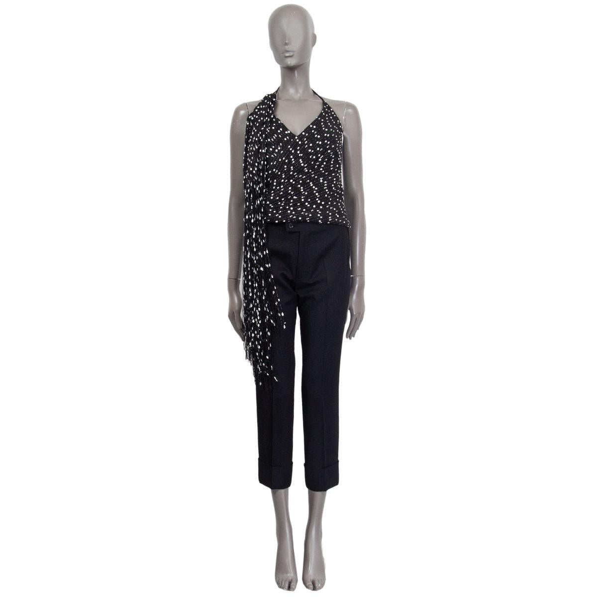 100% authentic Jacquemus La Riviera 'Le Haut Valoria' fringed top in black&white cotton (35%), polyamide (30%), polyester (25%) and viscose (10%) featuring a fringed drape starting from the right shoulder. Closes with one hook and a concealed zipper