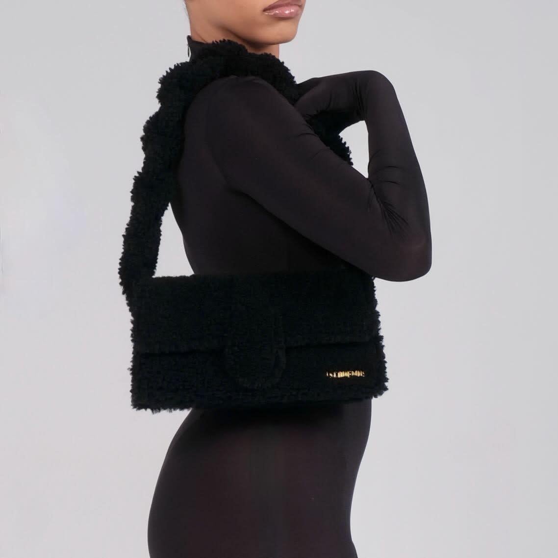 Color: Black
Material: shearing / teddy like fabric
Comes with: Dust bag
Condition: Excellent. Bag is pristine.
Made in Italy

Measurements~
Height 7.8”
Width 13”
Depth 2”
Drop 9”