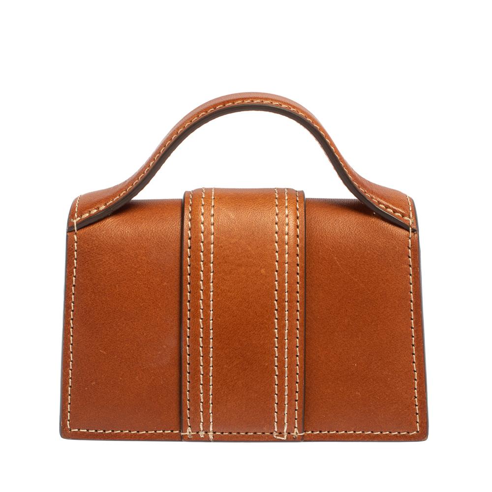 Jacquemus bags are every fashionista's dream come true. Designed in an impressive brown hue, this Le Petit Bambino bag offers the latest trend and utmost style. Designed from high-quality leather, this bag is equipped with a top handle, a mini