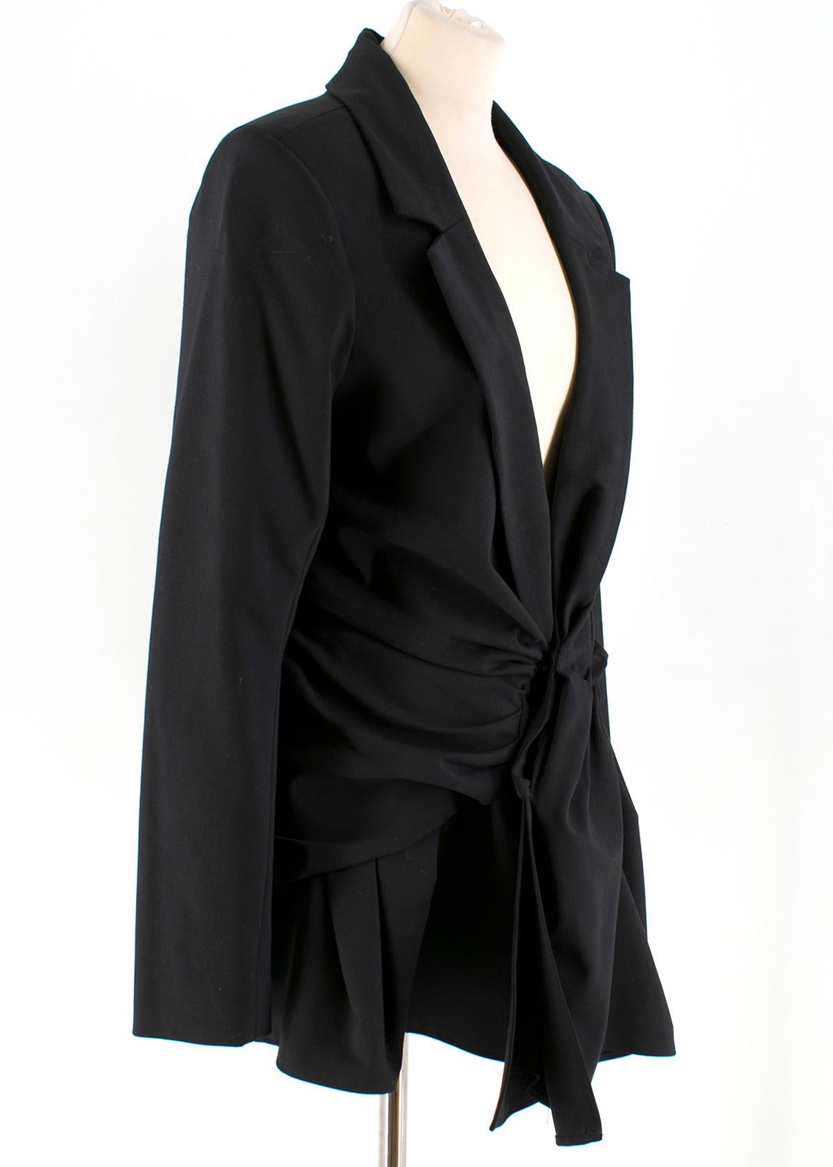 Jacquemus LA Bomba Blazer Dress

- Black, mid-weight, long sleeve wool-blend blazer dress
- Plunging v-neck
- Padded shoulders, notch lapels
- Ruched fitted skirt
- Centre-front button fastening
- Decorative chest welt pocket
- Ruffled trimmed hem
-