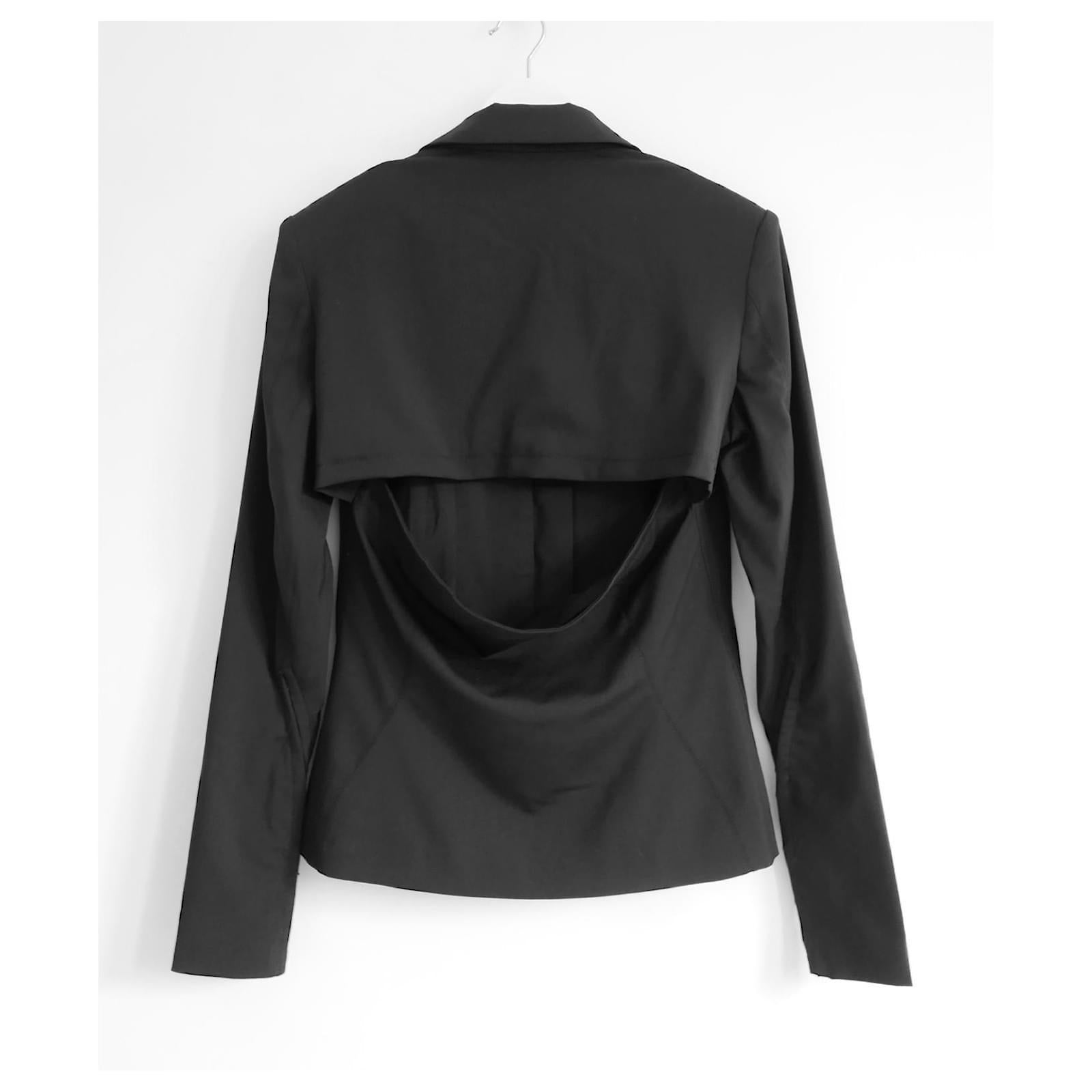 Ultra cool Jacquemus La Montagne open back jacket. bought for £1250 and new with tags. Made from smooth black wool and elastane with soft acetate/Cotton lining. It has a semi tailored cut with yoked open back detailing, curved seaming and hook and