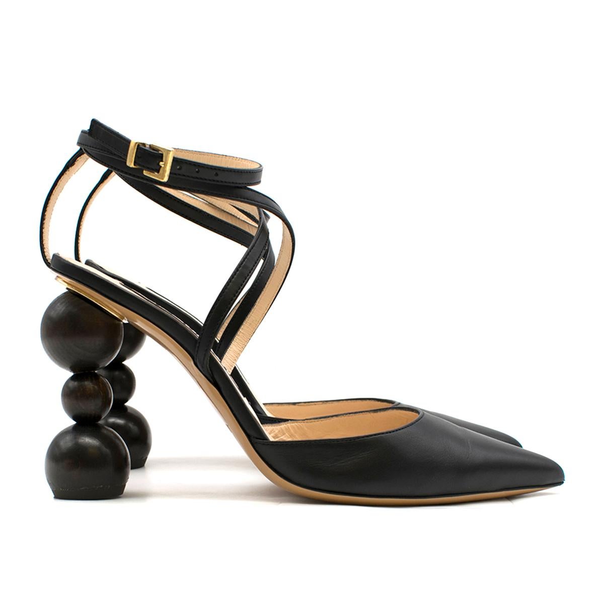 Jacquemus Les chaussures Camil Black Leather Pumps

-Black Leather pumps with geometric heel
- Black leather multilevel straps around ankle
- Pointy toe
- Round geometric heels
- Nude leather insole and sole

Please note, these items are pre-owned