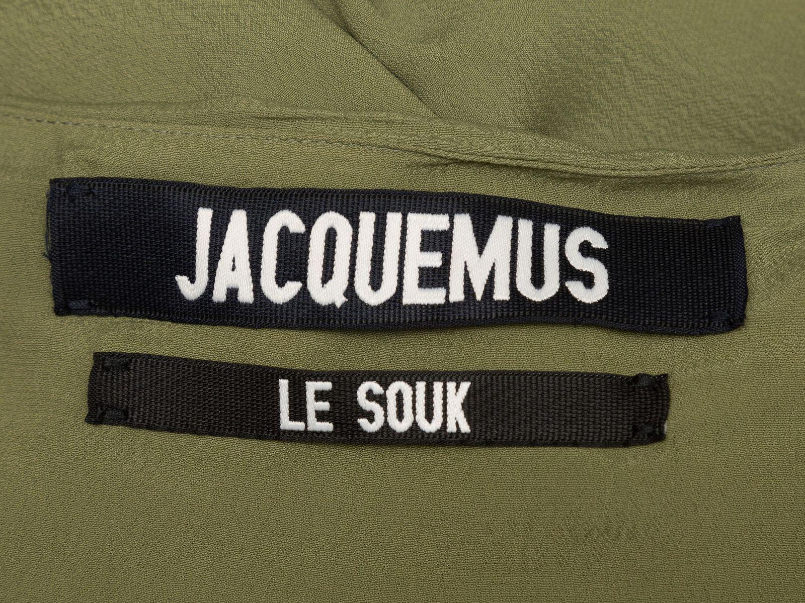 Product Details: Olive high-low skirt by Jacquemus. Gathered detailing at front waist. Zip closure at side. Designer size 34. 28