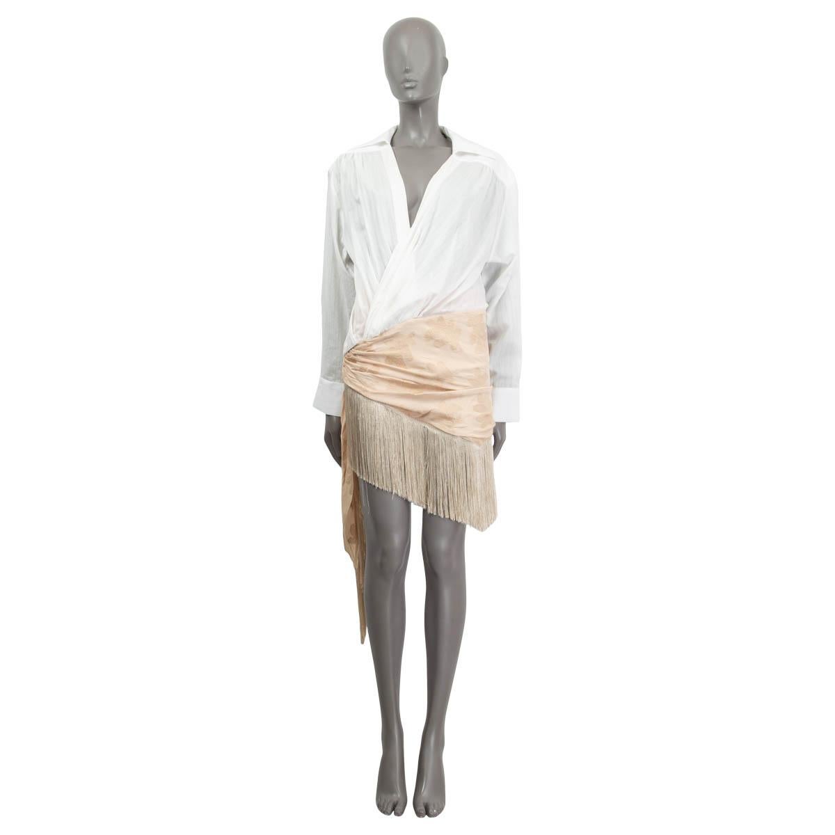100% authentic Jacquemus 'La Bomba - La Robe Pareo' mini shirt dress in white and dusty rose viscose (100%). Comes with a diagonal cut pareo skirt overlay and fringes at the hem. Opens with a concealed zipper on the side. Skirt lined in dusty rose