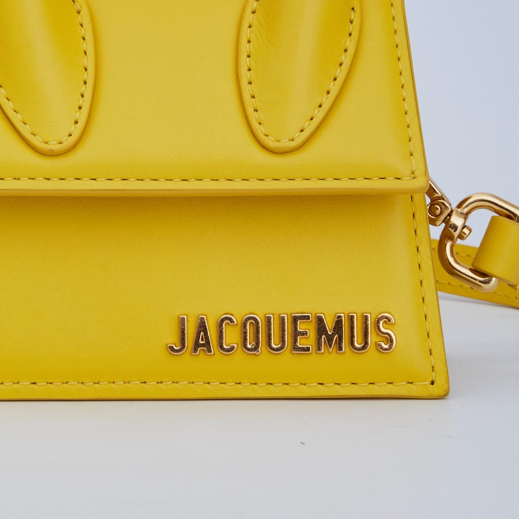 This bag is made with leather in buffed yellow. The bag features a logo plaque at face, single rolled carry handle at top, an adjustable and detachable shoulder strap, a fold over flap and twill lining in beige. Part of the La Montagne
