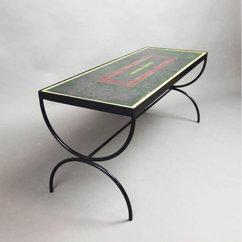 Jacques Adnet (1900/1984)
Coffee table
Lacquered metal and enamelled lava
1940/1950
L101 x W38 x H42 cms