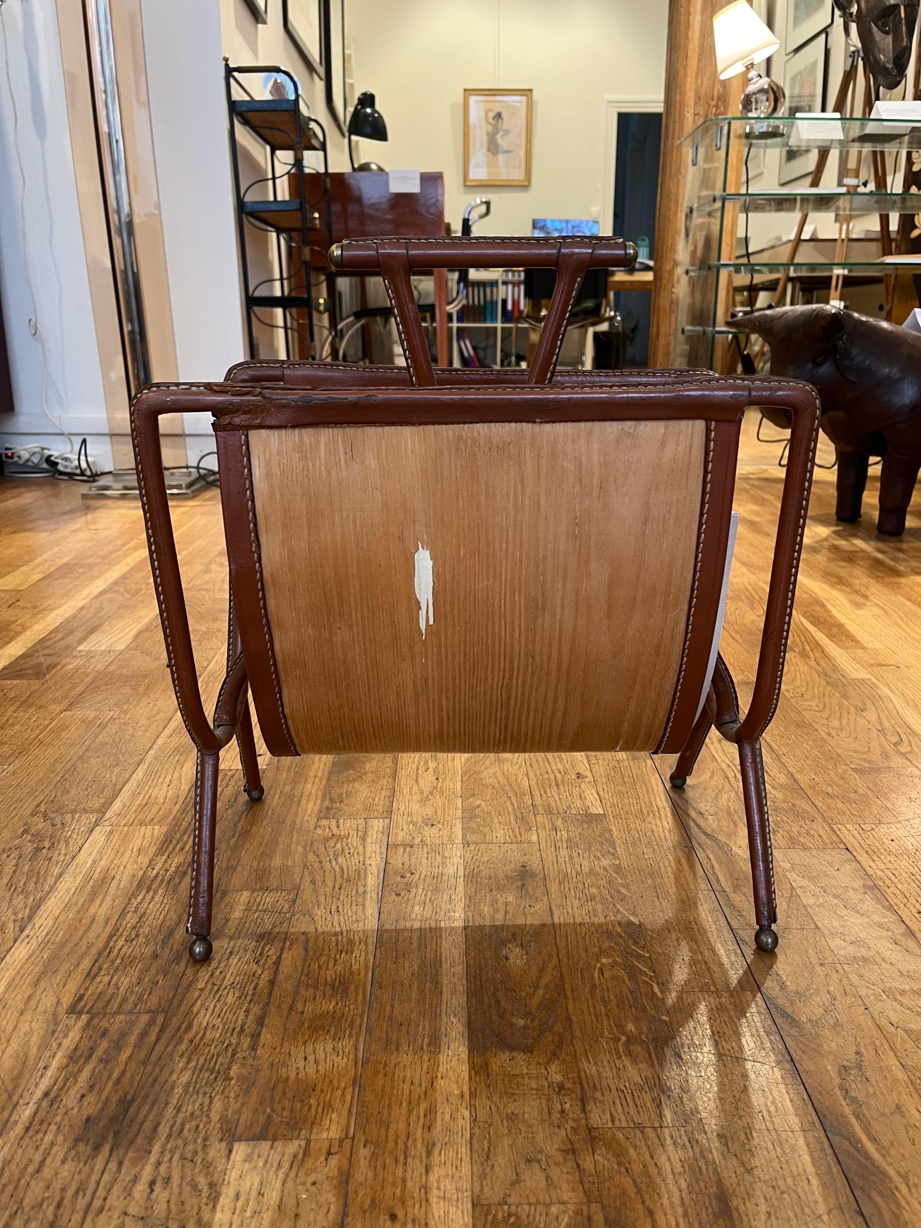 20th Century Jacques ADNET (1900-1984) Magazine rack with a metal structure