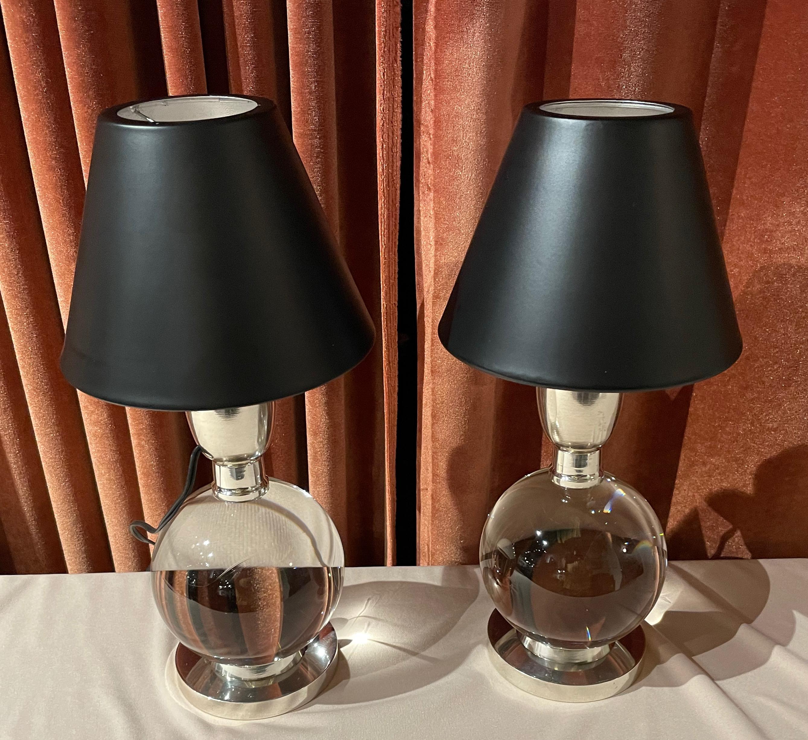 Rare pair of Jacques Adnet lamps made with Baccarat crystal and a nickel base. The balls can be moved to different positions. These lamps are from the 1940s and are documented in the Adnet book (model 7706). This particular pair is in exceptional