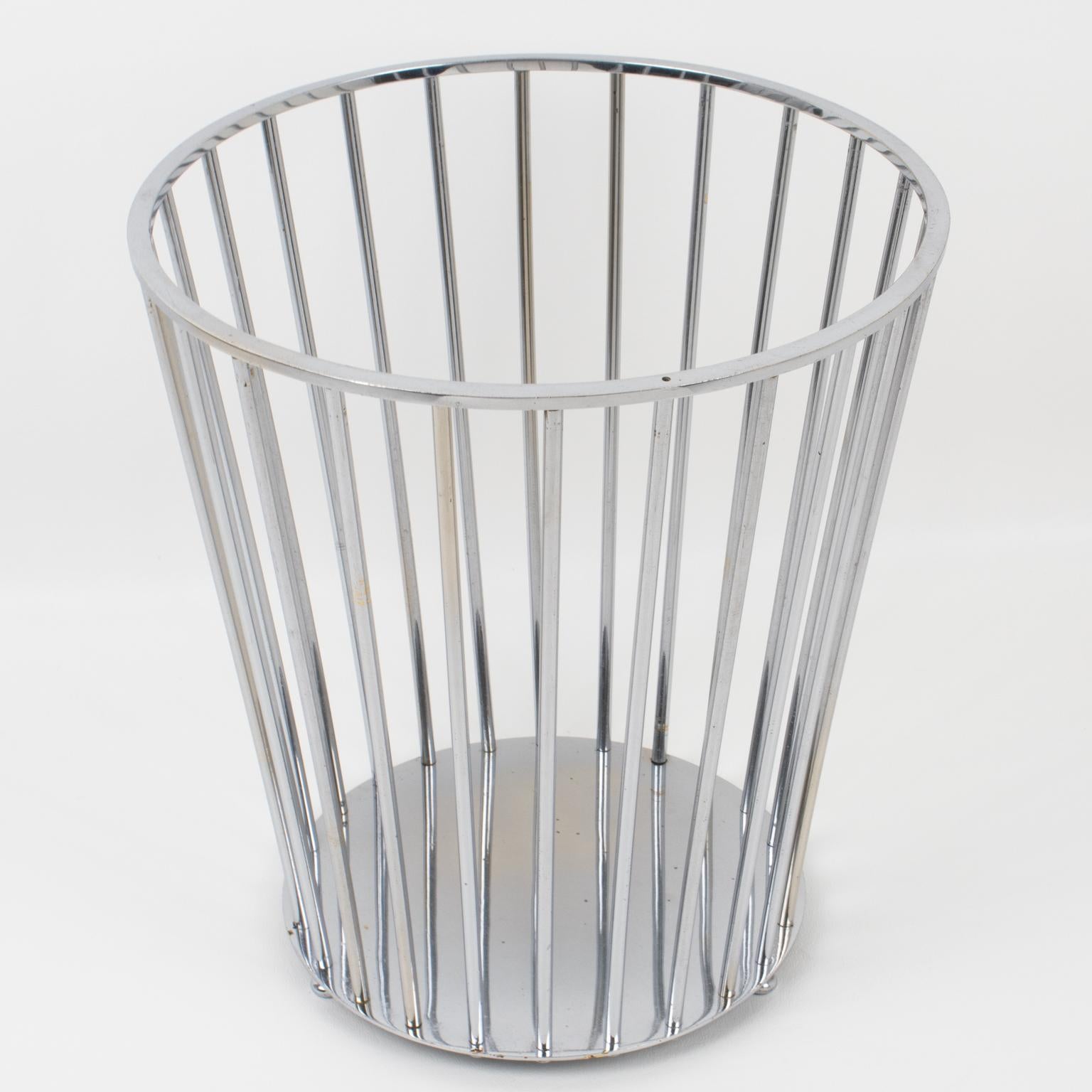 French designer Jacques Adnet (1900-1984) designed this elegant Art Deco modernist chromed metal desk accessory, or office waste basket. The minimalist geometric round shape features a typical Art Deco design with slim columns resting on a rounded
