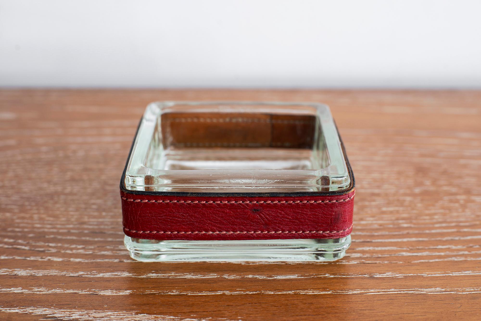 Thick square glass ashtray wrapped in red leather with white contrast stitch detailing.
Great gift idea!