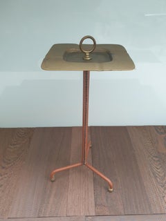 Stitched leather ashtray on stand by Jacques adnet.