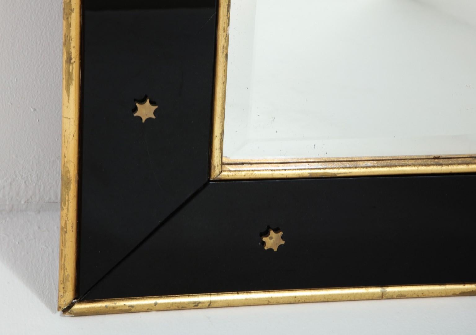 French Jacques Adnet Black Glass and Gold Leaf Wall Mirror with Star Detail, circa 1940