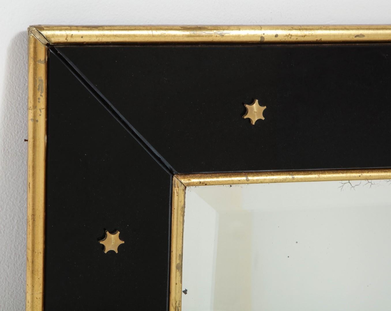 Mid-20th Century Jacques Adnet Black Glass and Gold Leaf Wall Mirror with Star Detail, circa 1940