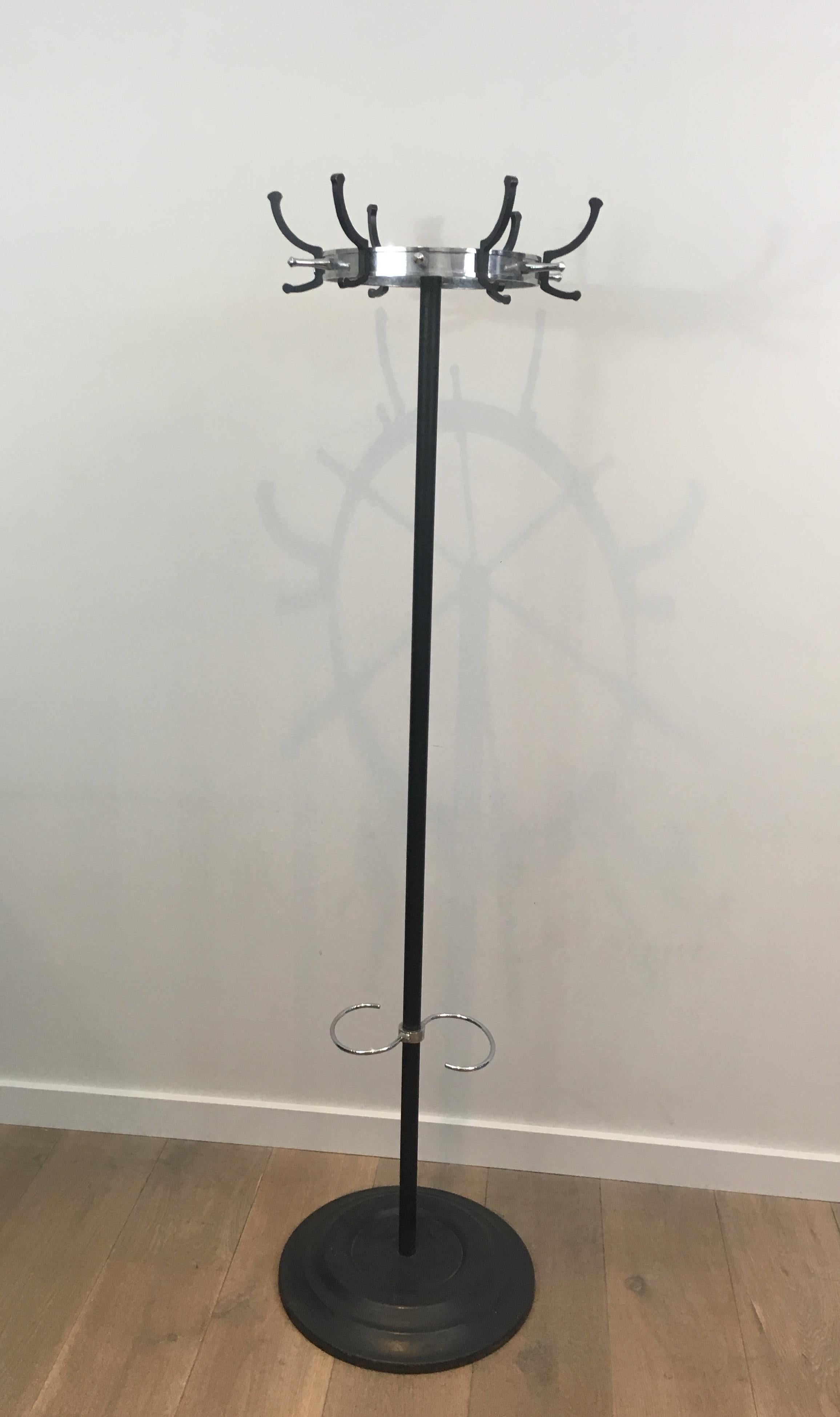 This nice standing coat rack is made of black lacquered metal and chrome. This is a model by famous French designer Jacques Adnet, made circa 1950.