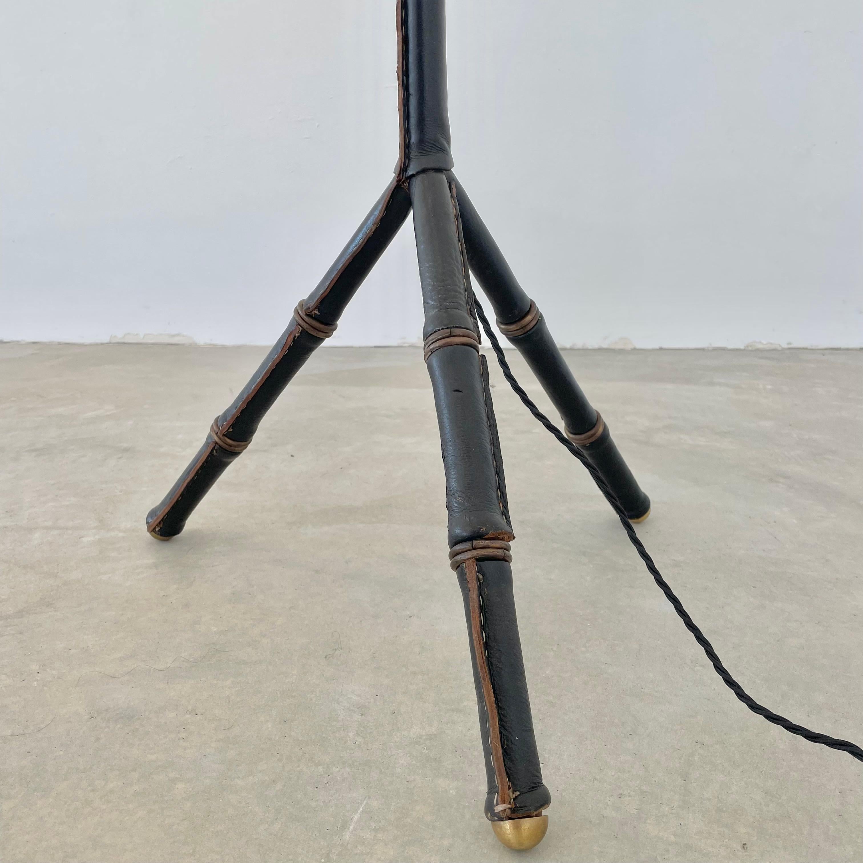 Mid-20th Century Jacques Adnet Black Leather and Brass Tripod Floor Lamp, 1950s France