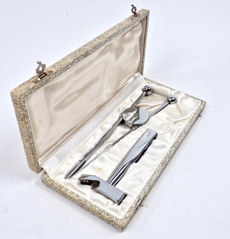 Jacques Adnet 1950s bottle opener / ice hammer and ice tongs bar set in original case. Stylish and functional bar wear from the master of French modernist design. Tongs L 20 cm. Opener: L 11.5 cm. Case L 24 x W 11 x D 3 cm. Very good boxed condition.