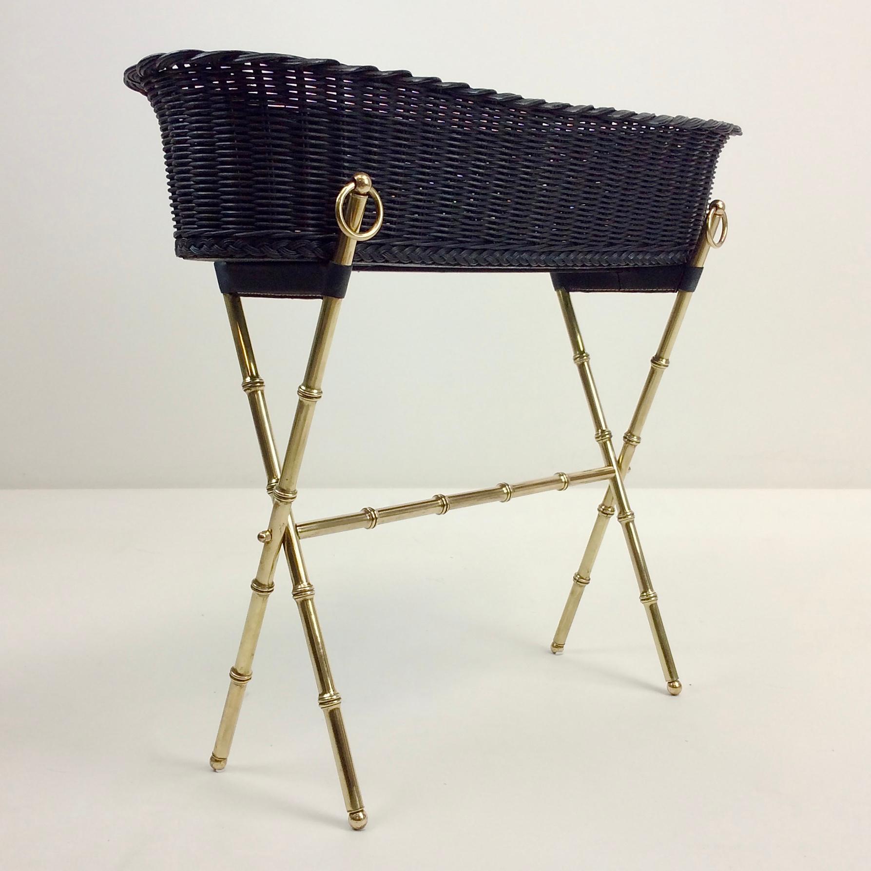 Rare Jacques Adnet jardinière, circa 1960, France.
Brass bamboo, blackened wicker basket, stitched black leather.
Dimensions: 65 cm H, 67 cm W, 27 cm D.
Original condition, brass has just been cleaned, photos before cleaning are available on