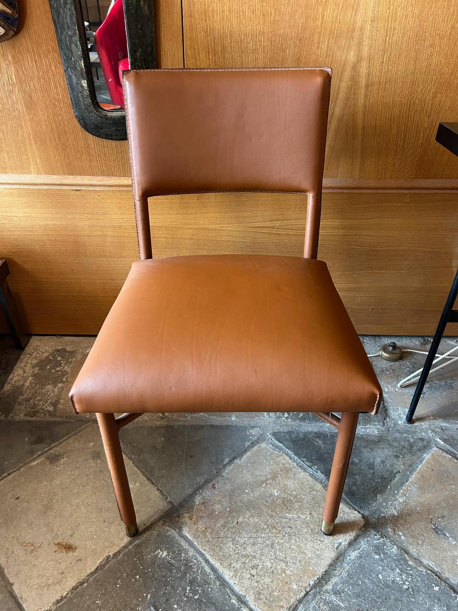 Hand-Crafted Jacques Adnet chairs For Sale