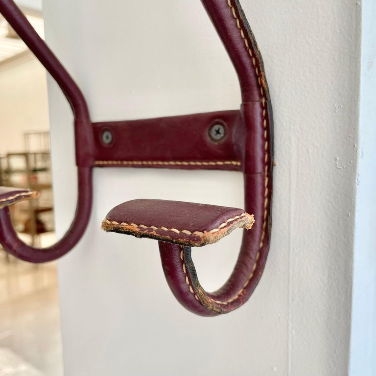 French Jacques Adnet Dual Leather Coat Hook, 1950s, France For Sale
