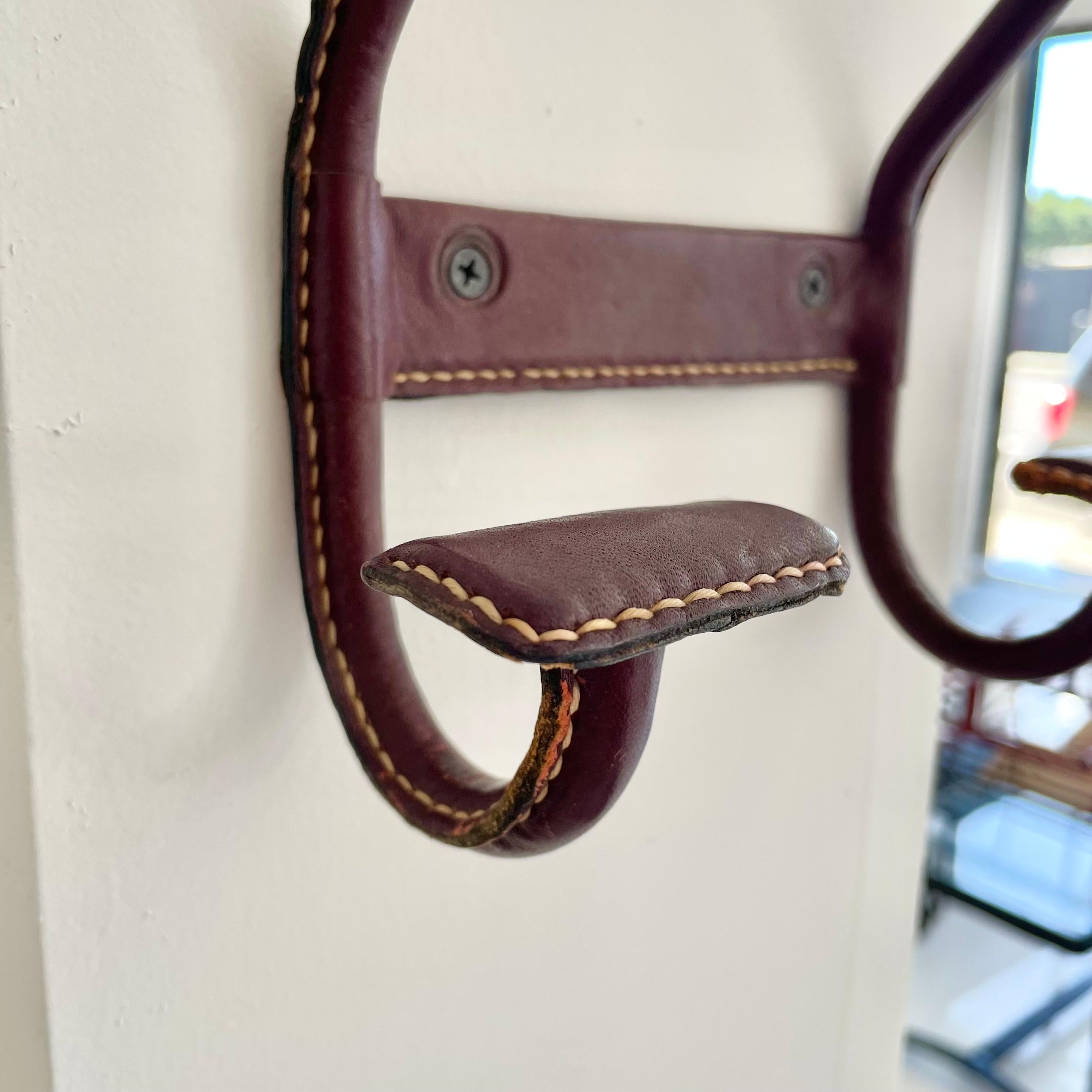 Jacques Adnet Dual Leather Coat Hook, 1950s France In Good Condition For Sale In Los Angeles, CA