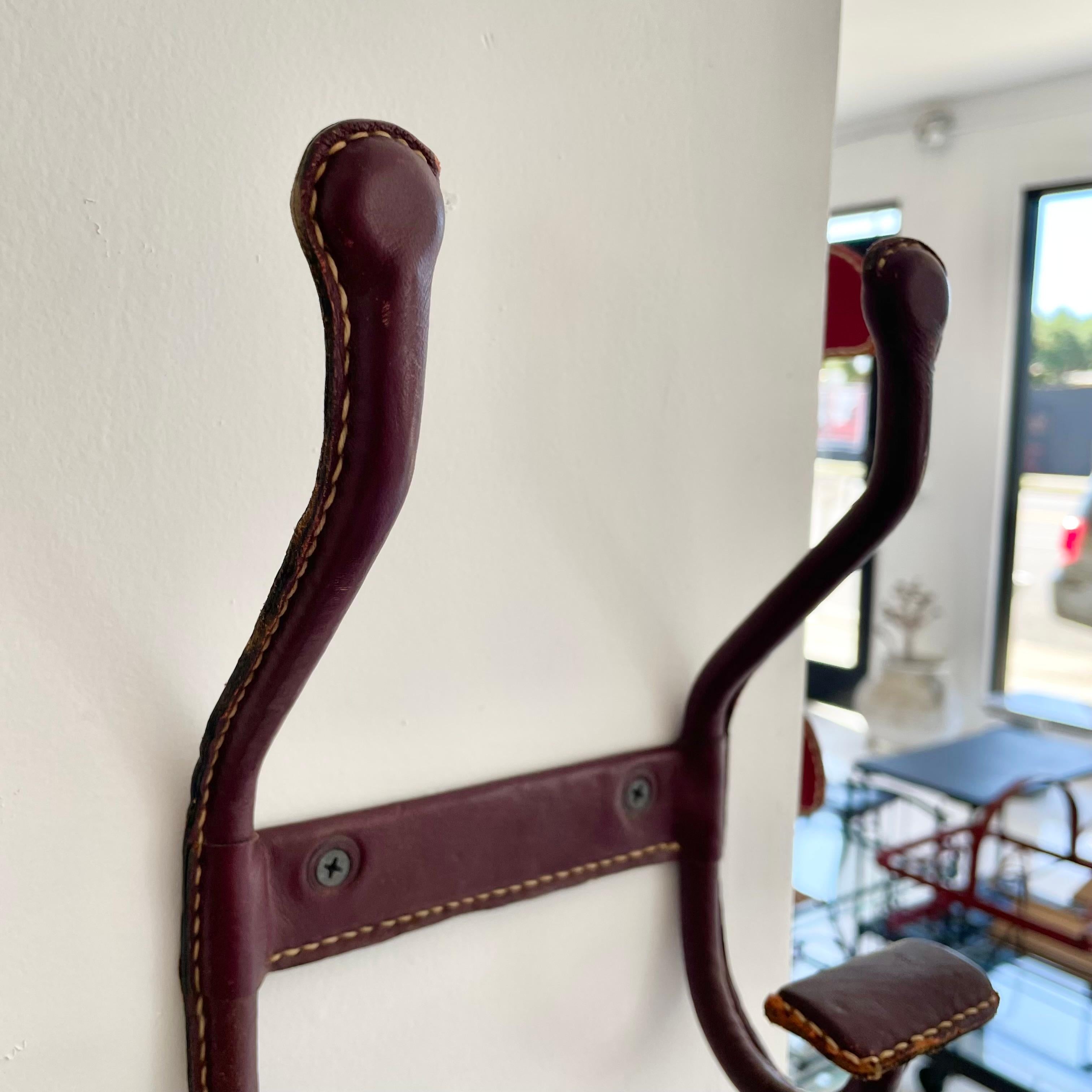 Mid-20th Century Jacques Adnet Dual Leather Coat Hook, 1950s France For Sale