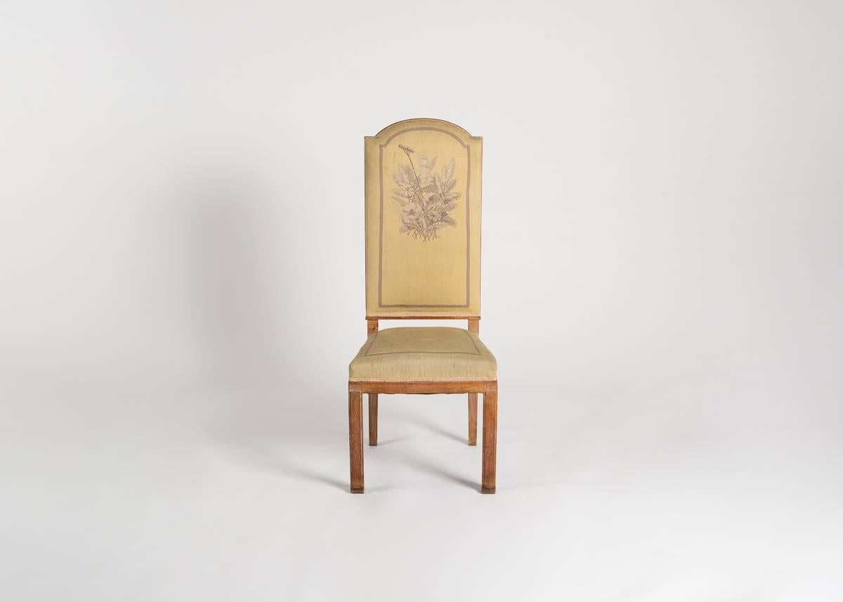 Eight fine and rare tall back side chairs by Jacques Adnet. Limed oak with original Aubusson tapestry.