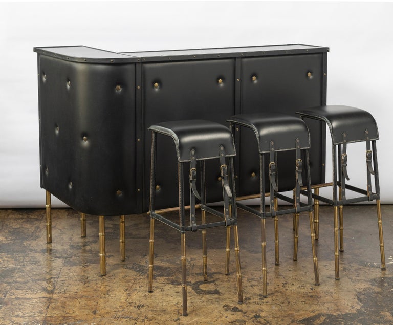 French Jacques Adnet Faux Leather Bar and Three Stitched Leather Stools with Brass Legs For Sale