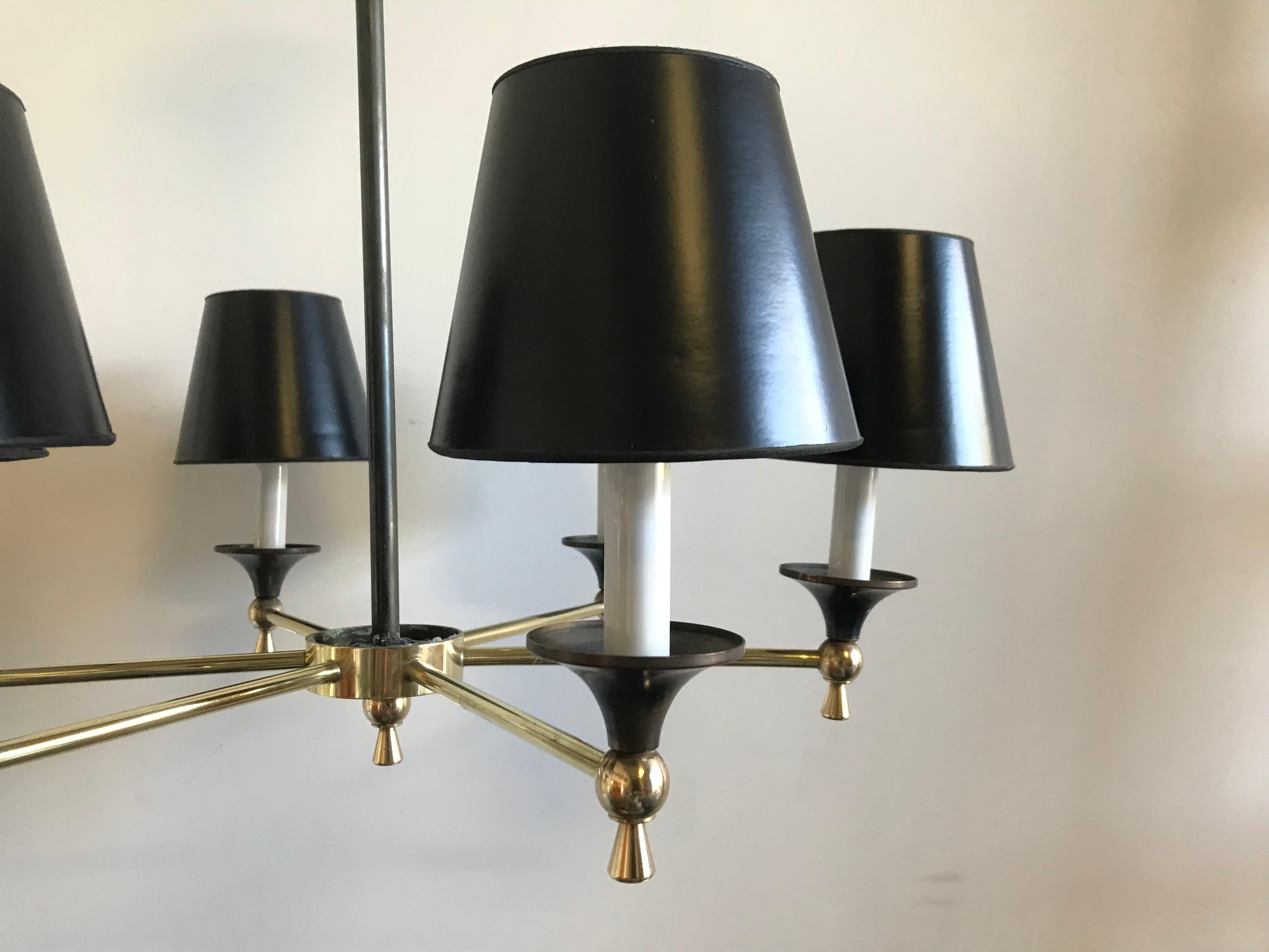 Beautiful brass and steel 6-light chandelier, circa 1950s by Jacques Adnet, Paris - excellent condition.

Adnet is a distinctive figure of French 20th century design born in France in 1901. He believed in the functional aspect of furniture combined