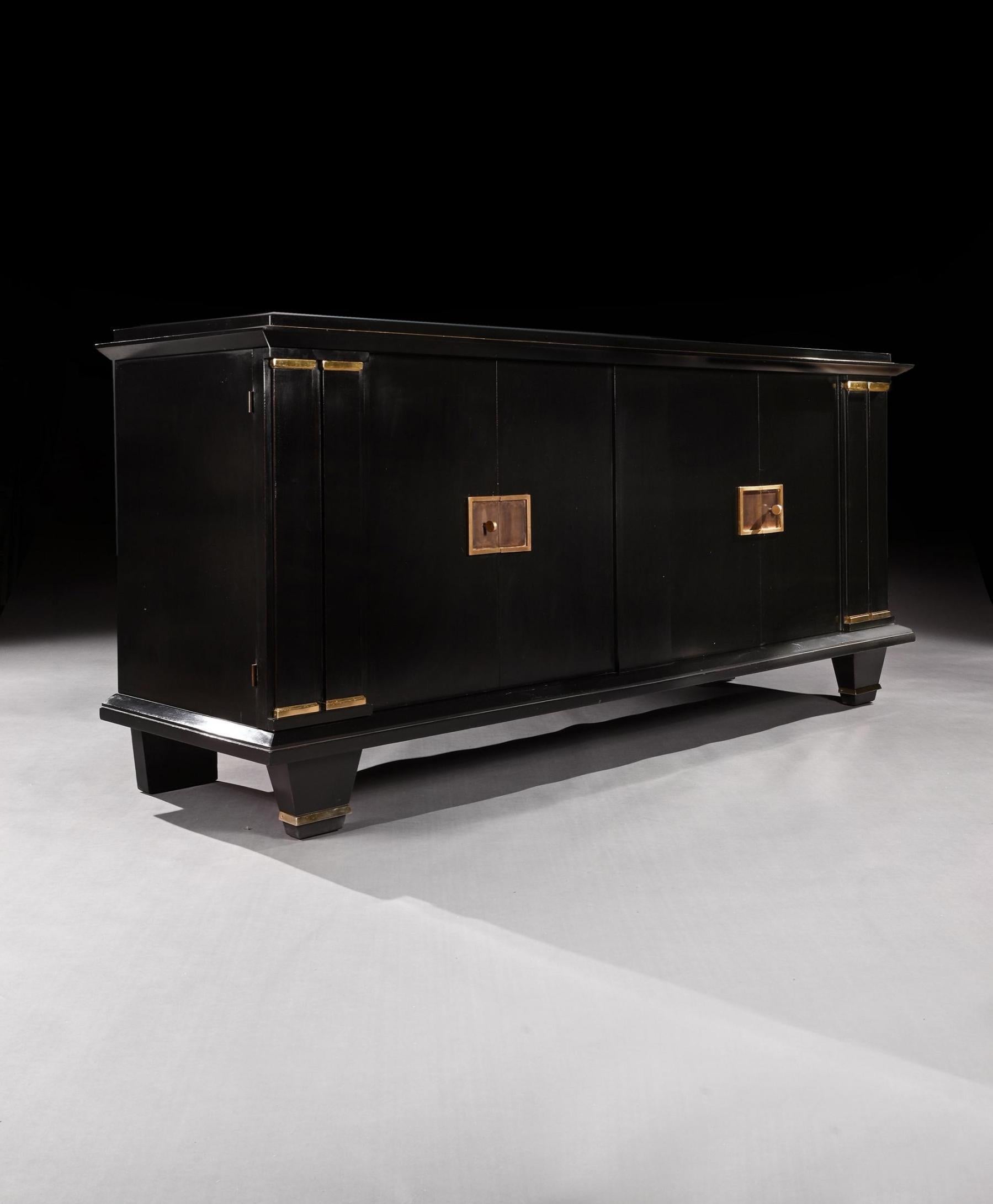 A chic French Modernist ebonised four door sideboard from the Art Deco period, gilt bronze mounted, very much in the manner which could be attributable to Jacque Adnet (1900-1984).


French Art Deco - 1940. 

Of superb construction and