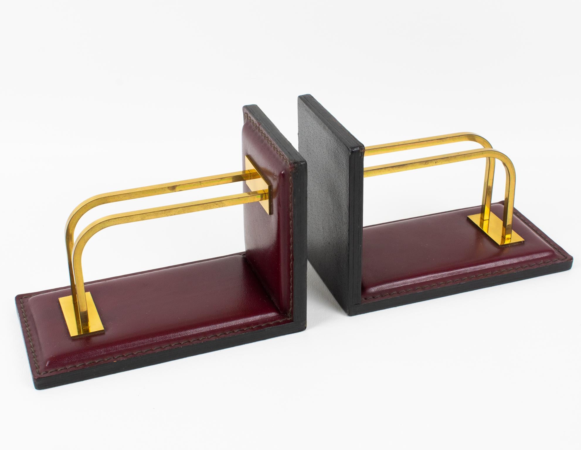 These lovely 1950s leather bookends were designed by French designer Jacques Adnet (1901-1984) and probably manufactured by ILG in Belgium. 