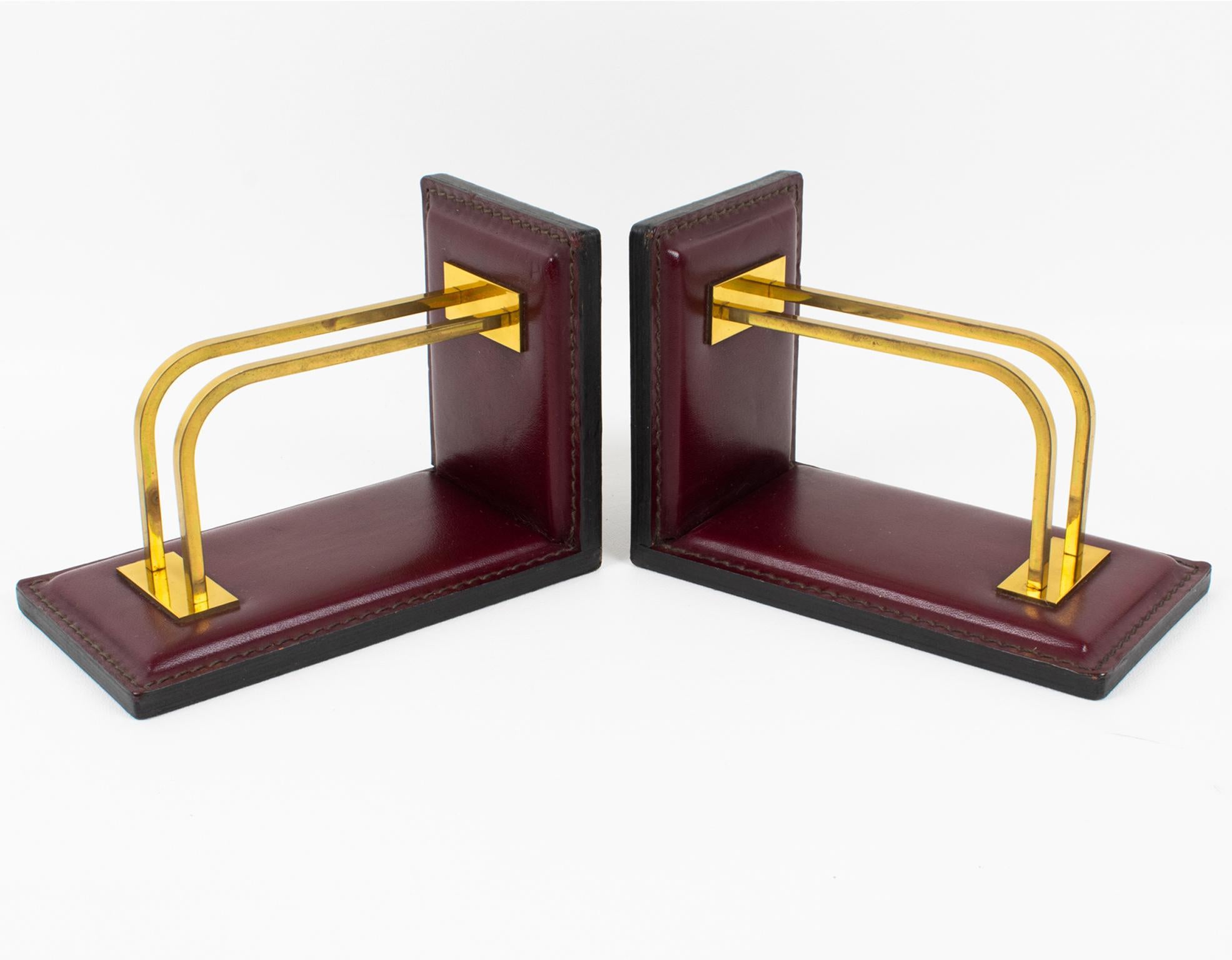 French Jacques Adnet Hand-Stitched Red Leather and Brass Bookends