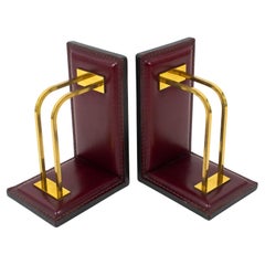 Jacques Adnet Hand-Stitched Red Leather and Brass Bookends