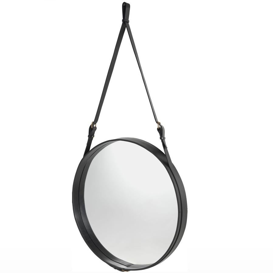 Jacques Adnet large Circulaire mirror with black leather. Designed in 1950 by Jacques Adnet and executed in leather, brass, and glass. The Circulaire mirror was the result of a partnership Adnet formed with the exclusive French fashion house Hermès,