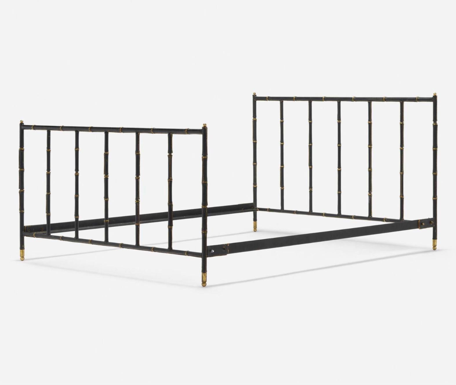 Jacques Adnet Leather and Brass Full Size Bed Frame, France 1950. Bed frame is saddle stitched leather over steel, brass. Bed frame shows beautiful rich patina.
Measures 37