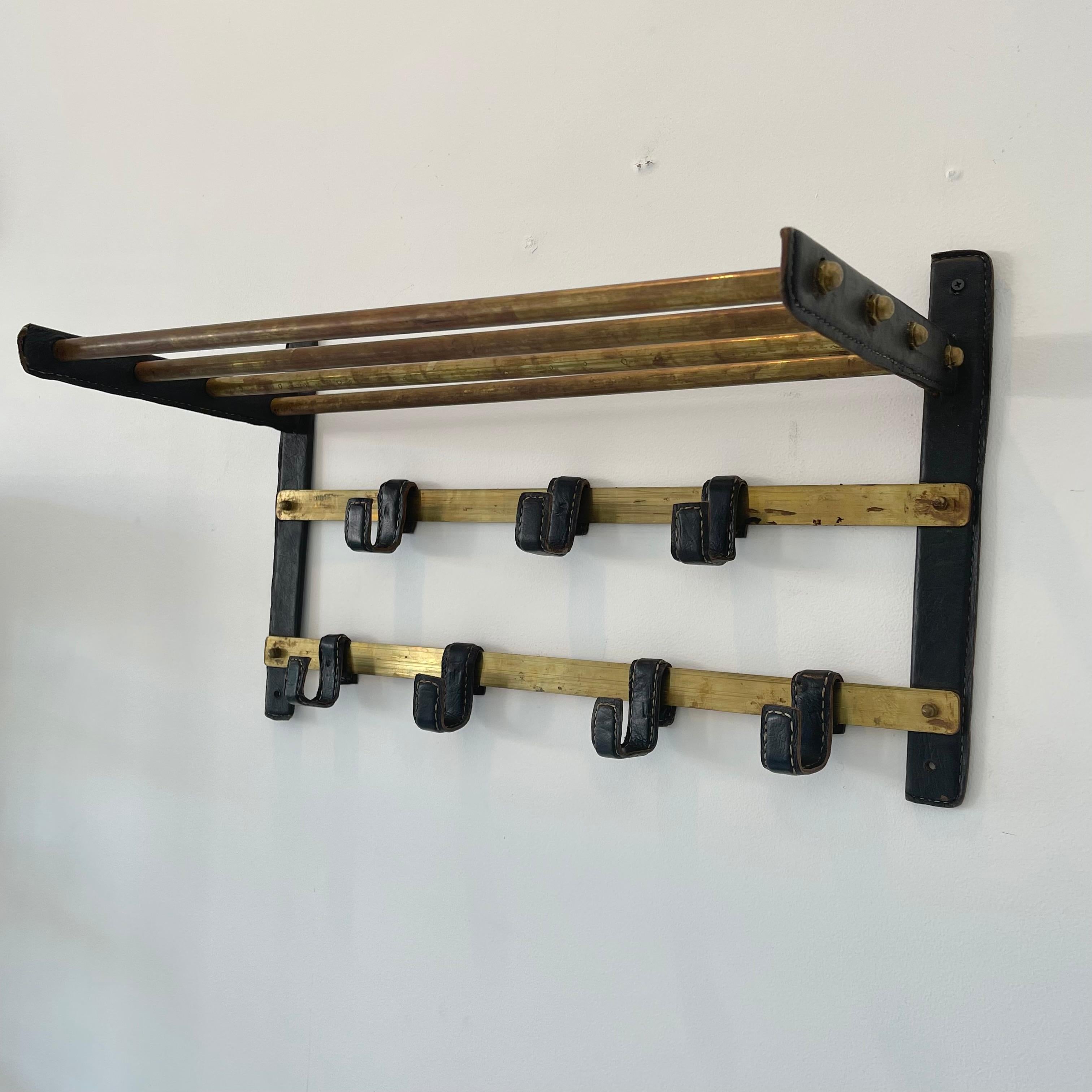 Jacques Adnet Leather and Brass Wall Rack, 1950s France In Good Condition For Sale In Los Angeles, CA