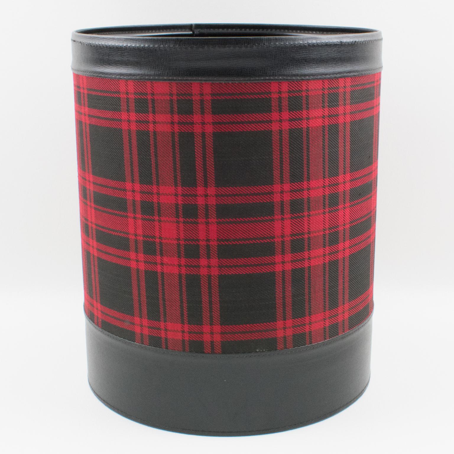 A functional 1950s modernist desk accessory, office waste-basket by French Designer Jacques Adnet, (1900-1984). Streamline shape with black hand-stitched leather and black and red fabric plaid (Scottish tartan). A very nice addition to your next